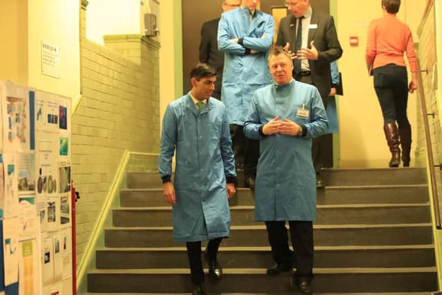 Chancellor Rishi Sunak (left) during a visit to the pathology labs at Leeds General Infirmary. to view the procedures that will be used by the lab when it begins to receive coronavirus samples for testing. Photo: PA