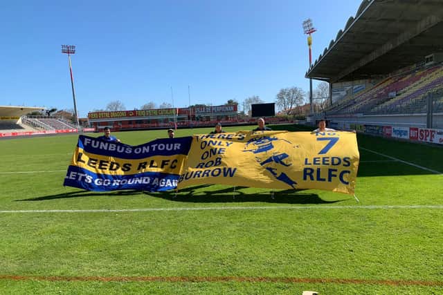 Christina Floyd paid a 70 excess bagage fee to take his Rob Burrow flag to France. At least he and it got to visit Stade Gilbert Brutus.