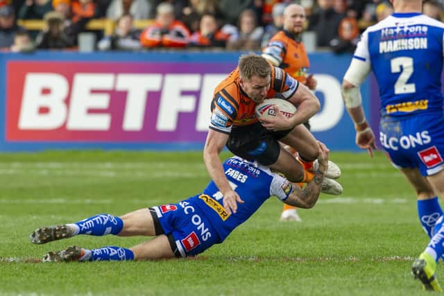 15 March  2020 .....    Castleford Tigers' Michael Shenton is tackled by St Helens' Theo Fages at Wheldon Road on Sunday. Picture: Tony Johnson