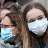 Spectators wearing masks to protect against coronavirus in London.  Photo credit: Jonathan Brady