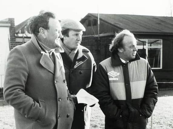 From left to right: Don Revie, Don Warters and Billy Bremner watching Leeds United training