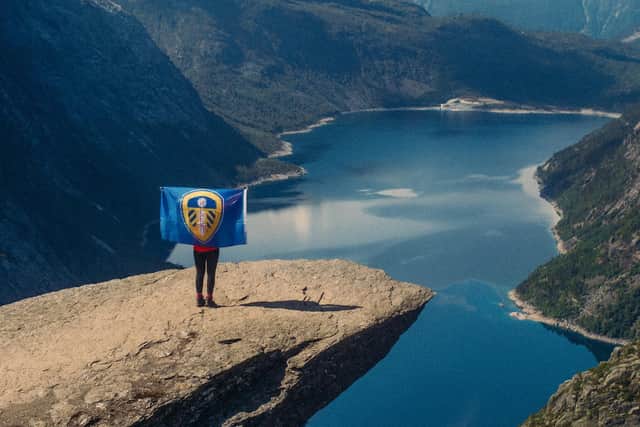 Victoria Tidmarsh representing the Leeds United colours at 4,000ft on Trolltunga in Norway