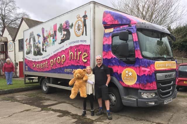 Maggie Snodgrass, nine, with the driver from Event Prop Hire who took the 4,000 teddies on their 200-mile trip to The Teddy Trust's office in Hereford.