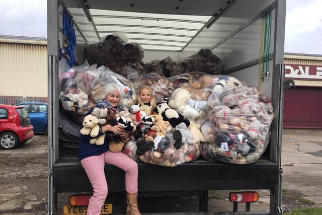 Maggie Snodgrass, nine, and Teddy Trust founder Ellie Somme with the bagged up teddies, about to leave Event Prop Hire's HQ in Wetherby.