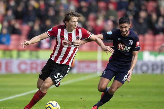 DELAYED RETURN: Sheffield United's Sander Berge holds off Bournemouth's Andrew Surman. Picture: Simon Bellis/Sportimage