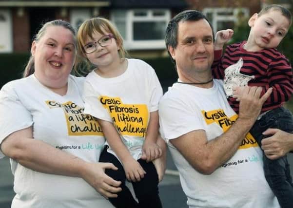 Laura and David Venner with two of their five children, seven-year-old Abbie and three-year-old Oliver. Abbie and Oliver have cystic fibrosis