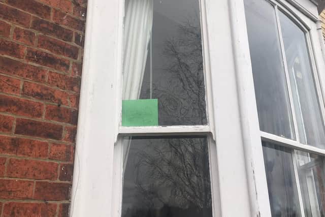 The street have posted green cards in their windows cc Beth Crompton