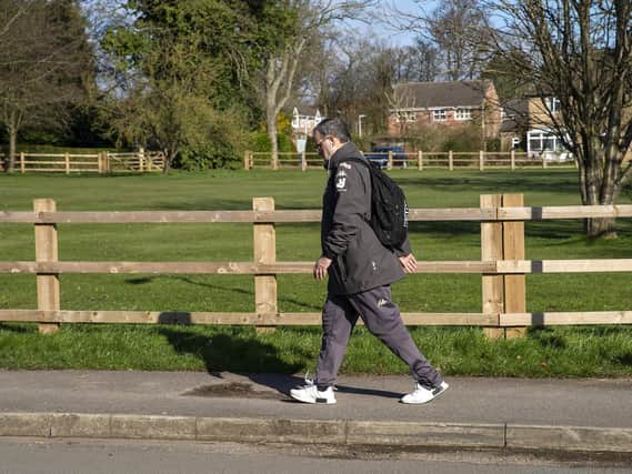 Marcelo Bielsa pictured walking to work at Thorp Arch, before Leeds United sent the players home to train (Pic: PA)