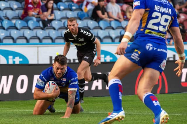 Tom Briscoe scores at Huddersfield last August, moments before his season was ended by an anterior cruciate ligament injury. Picture by Bruce Rollinson.