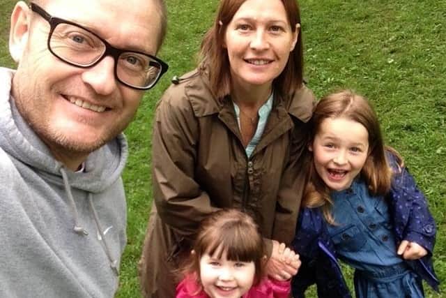 Lloyd with his wife Tina and daughters Gracie, 11, and Lola, seven.