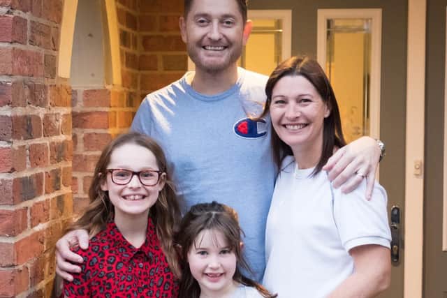 Lloyd Pinder, who has been diagnosed with advanced prostate cancer, with his wife Tina and daughter Gracie, 11, and Lola, seven.