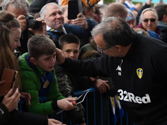 Marcelo Bielsa greeting a young fan at Elland Road (Pic: Getty)
