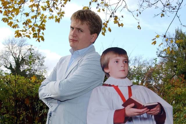 A young Aled Jones posing with a photo of an even younger Aled Jones. Photo: Yui Mok/PA