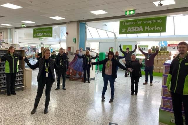 Simon Golwler (back right) with staff at Asda  Morley