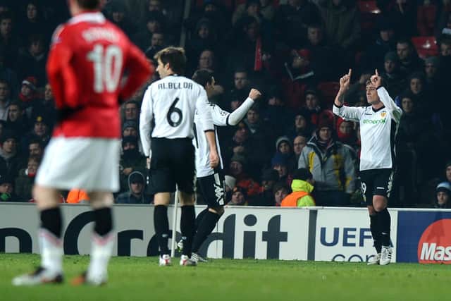 NOTABLE STRIKE: Wayne Rooney looks on as Pablo Hernandez, right, puts Valencia 1-0 up against Manchester United at Old Trafford in a Champions League tie back in December 2010. Photo by PAUL ELLIS/AFP via Getty Images.