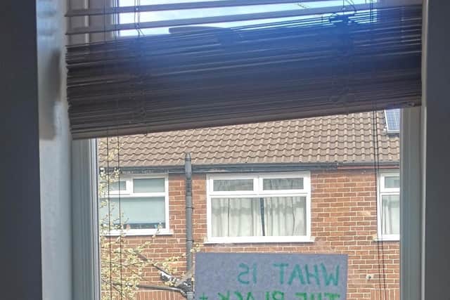Sian Cosgrove posted the sign on the window to find out what her neighbour's cat was called.