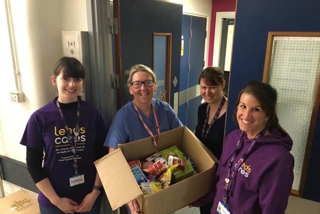 Codie Heneachon (left) of Leeds Cares helping support NHS workers on the coronavirus frontline.