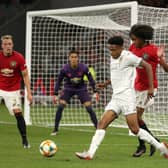 PROSPECT: Bryce Hosannah of Leeds United controls the ball against Tahith Chong of Manchester United as Phil Jones looks on in a pre-season game in Australia. Pic: Getty.