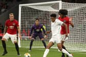 PROSPECT: Bryce Hosannah of Leeds United controls the ball against Tahith Chong of Manchester United as Phil Jones looks on in a pre-season game in Australia. Pic: Getty.