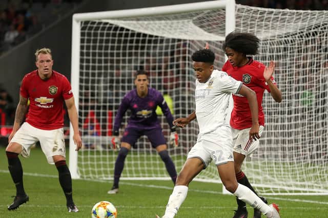 PROSPECT: Bryce Hosannah of Leeds United controls the ball against Tahith Chong of Manchester United as Phil Jones looks on in a pre-season game in Australia. Pic: Getty.