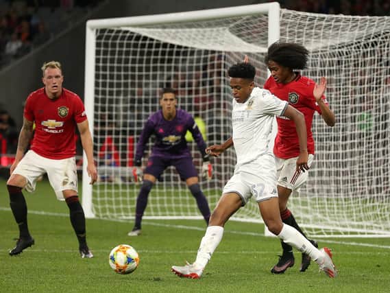 PROSPECT: Bryce Hosannah of Leeds United controls the ball against Tahith Chong of Manchester United as Phil Jones looks on in a pre-season game in Australia. Pic: Getty.