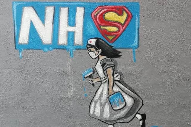 The mural on the pub wall.