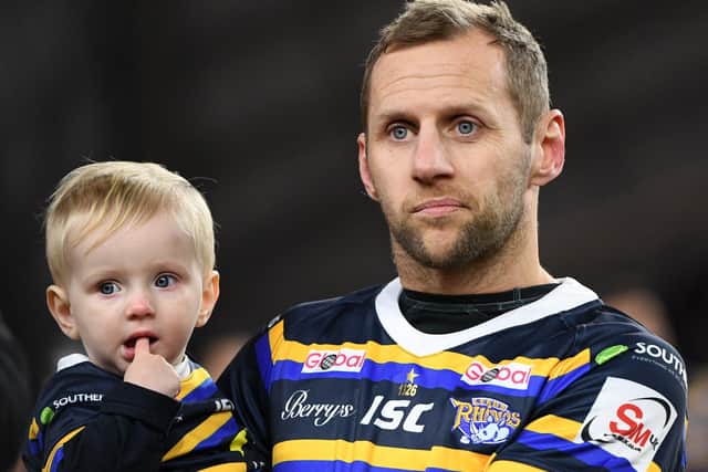 Rob Burrow with his son Jackson.
 Picture: Steve Riding.
