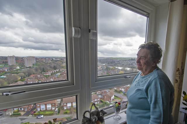 Sandra Ogden takes in the view from her 13th floor flat in Gamble Grange at Wortley.