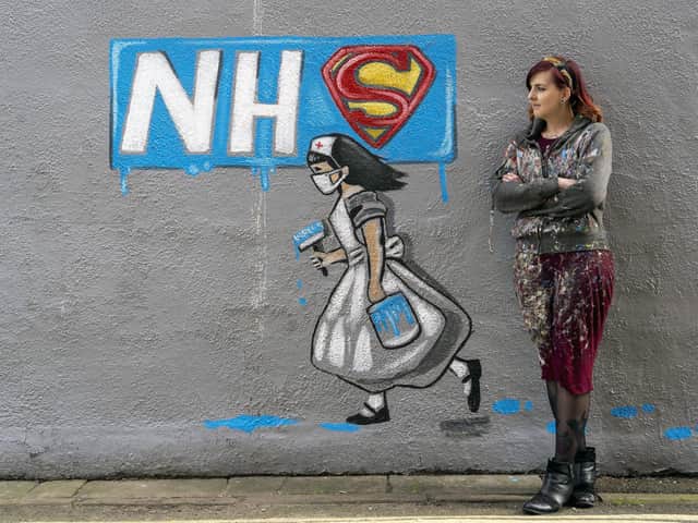 Artist Rachel List with her NHS mural in Pontefract.
