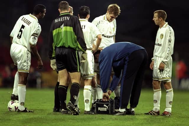 FORMER TEAM MATES: Nigel Martyn, left, and Jonathan Woodgate, centre, pictured in Leeds United's clash at Wimbledon in November 1999. Picture by Gary Prior /Allsport