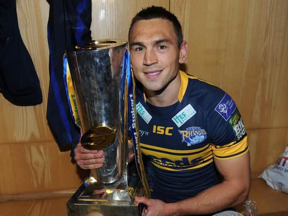 Kevin Sinfield shows off the Super League trophy after Rhinos' 2012 win at Old Trafford. Picture by Steve Riding.