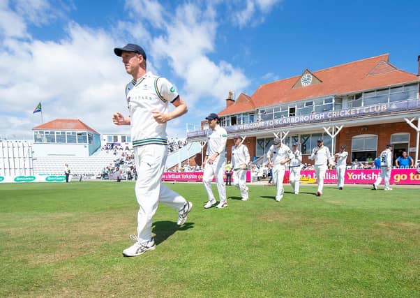 ON LEAVE: Steve Patterson leads his side out against Surrey at North Marine Road last summer. All of this year's Yorkshire squad have been placed on furlough due to the coronavirus pandemic. Picture: Allan McKenzie/SWpix.com