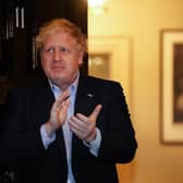 Prime Minister Boris Johnson clapping outside 11 Downing Street in London to salute local heroes during Thursday's nationwide Clap for Carers NHS initiative to applaud NHS workers fighting the coronavirus pandemic. Photo: PA