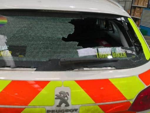 The back windshield of the police car was smashed in the incident