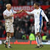 PUT IT THERE: Jermaine Beckford, right, and Patrick Kisnorbo celebrate Leeds United's 1-0 win at Manchester United in the FA Cup in January 2010, and now the game will be broadcast in full tonight. Photo by Alex Livesey/Getty Images.