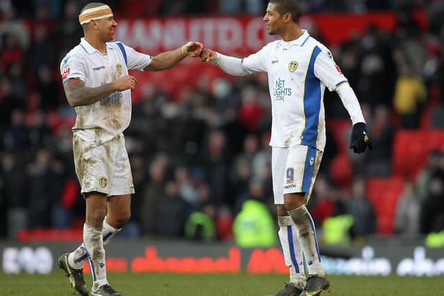PUT IT THERE: Jermaine Beckford, right, and Patrick Kisnorbo celebrate Leeds United's 1-0 win at Manchester United in the FA Cup in January 2010, and now the game will be broadcast in full tonight. Photo by Alex Livesey/Getty Images.
