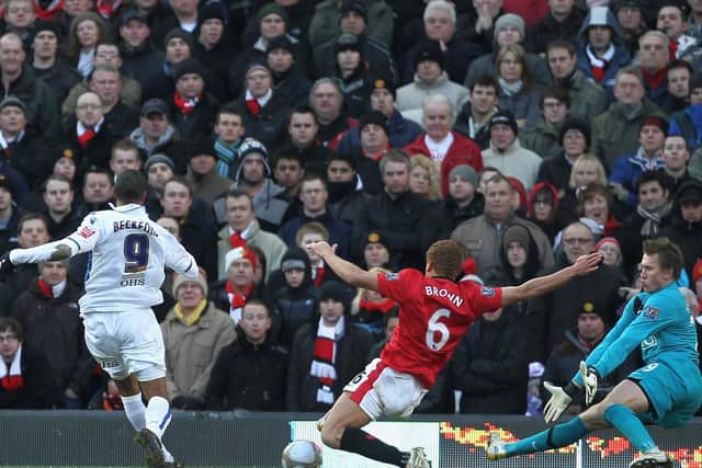GLUM FACES: On the Manchester United fans as Jermaine Beckford coolly slots home the only goal of the game. Photo by PAUL ELLIS/AFP via Getty Images.