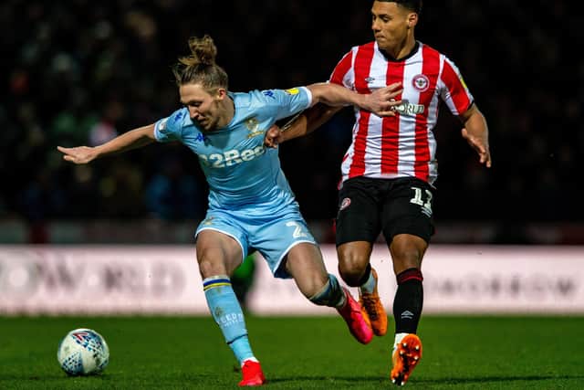WILY CAMPAIGNER: Luke Ayling holds off Brentford's Ollie Watkins.
 Picture: Bruce Rollinson.