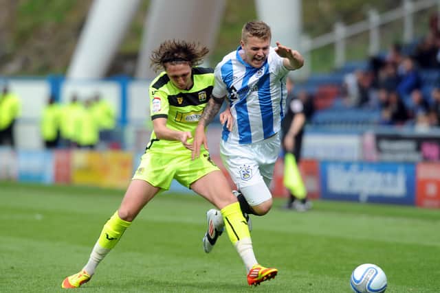 Luke Ayling challenges Huddersfield's Danny Ward while playing for Yeovil Town. Picture: Tony Johnson.