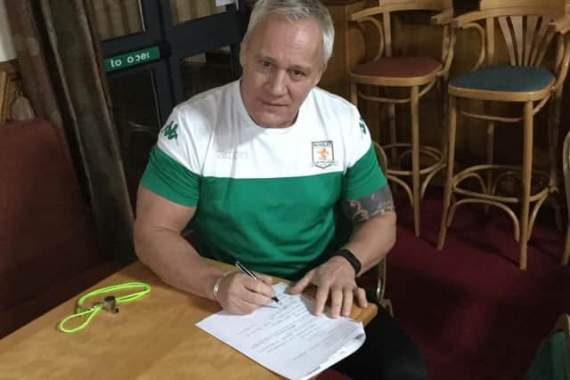 Coach Gary Thornton signs up to one of Hunslet's membership schemes.