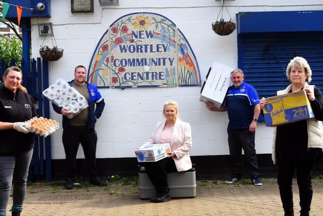 Members of the New Wortley Community Association with some of the items they are getting ready for their food parcels. (Credit: Gary Longbottom)