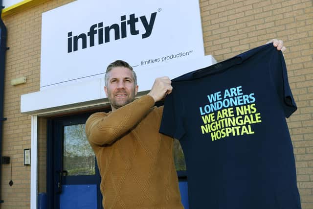 The team at Infinity Apparel have started printing thousands of nurses T-shirts for NHS Nightingale (Photo: Jonathan Gawthorpe)