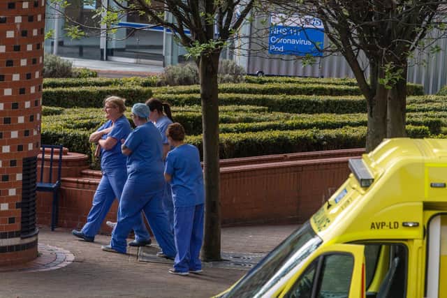 Medical staff leaving the hospital close to the A&E unit at Leeds General Infirmary.
