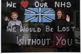 Lydia Hardwick aged 11 with her brother Daniel aged 8, support the NHS by painting their window through the Coronavirus outbrea, at Oulton.