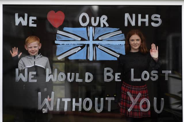 Lydia Hardwick aged 11 with her brother Daniel aged 8, support the NHS by painting their window through the Coronavirus outbrea, at Oulton.