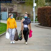 Women wear face masks with shopping in Bradford as people continue to observe social distancing rules during the Corona Virus pandemic.
9 April 2020. Picture Bruce Rollinson