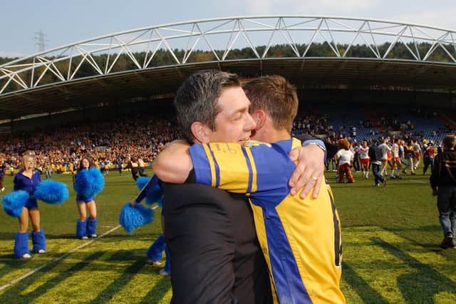 Coach Daryl Powell and match-winner Danny McGuire celebrate after the final whistle. Picture by Steve Riding.