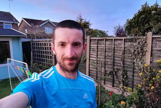 Neil Musgrove running an ultra-marathon in his back garden.