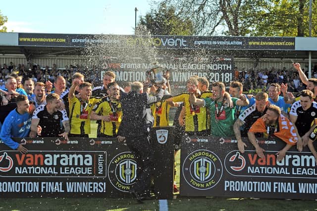 PARTY TIME: Harrogate Town's staff and players celebrate promotion to the National League after beating Brackley 3-0 in May 2018. Picture: Tony Johnson.