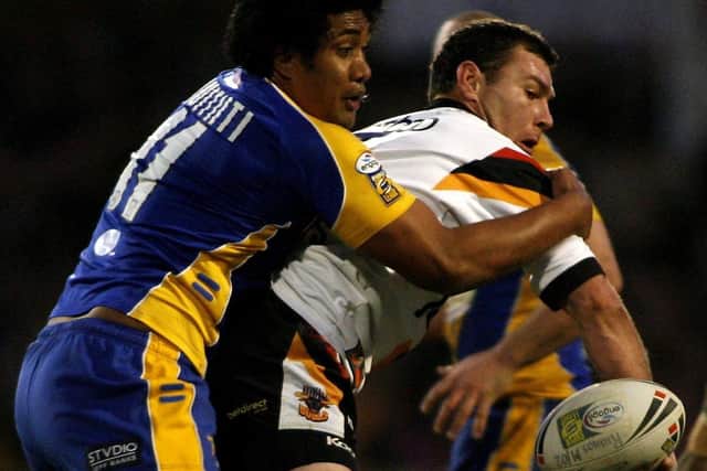 Ali Lauitiiti makes a tackle against Bradford Bulls in 2006. Picture: Gareth Copley/PA.